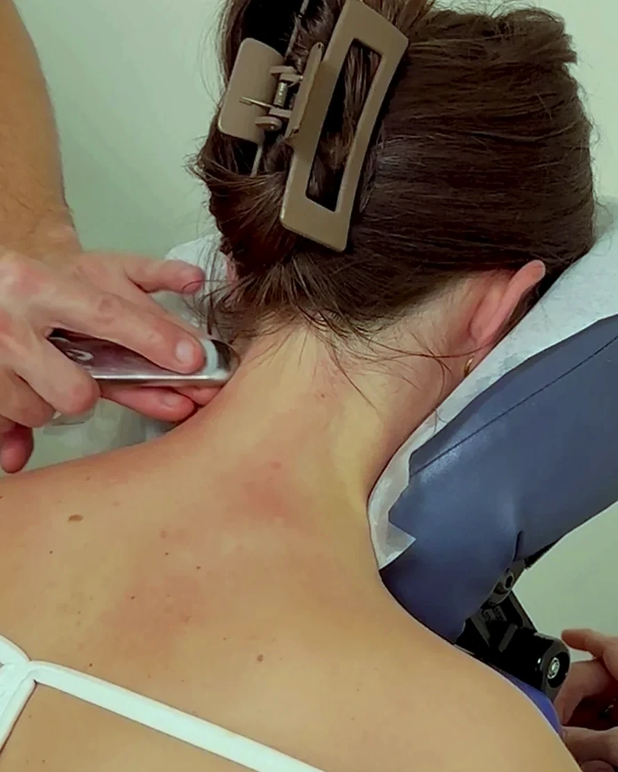 Instrument-assisted myofascial release along the side of the neck at Achieve Chiropractic in Newport News, VA